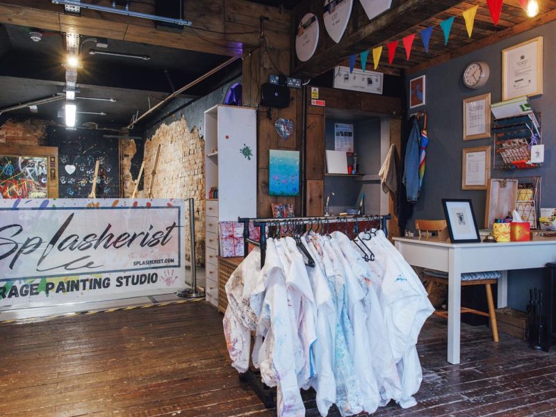 Splasherist Bath studio interior at 12 Widcombe Parade, Bath, a rage painting and splash art venue with brick walls and creative paint play space